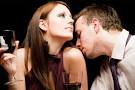 Man smelling woman