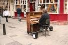 Pianist busking in Minster Yard - via Daymix