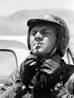 Actor Steve McQueen Putting on