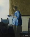 WOMAN IN BLUE READING A LETTER by Johannes Vermeer