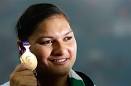New Zealand's Valerie Adams poses with her gold medal. - new_zealand_s_valerie_adams_poses_with_her_gold_me_4cb0e48264