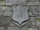 It is located at the stone walled buildings in this image H6734 : Belgium - via Daymix