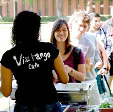 Diana Tay, a sophomore majoring in communication and English, samples food from Viztango Cafe as part of “Taste of Downtown L.A.” The event, ... - featureart_web1