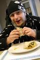 Patron Nick DeFelice enjoys one of the many wraps offered at the ... - 1-6-10-ezneupclose2jpg-bc9bd8b891998626_medium