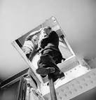 File:A fireman of the National Fire Service slides down the