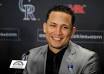 Carlos Gonzalez considered his baseball family and his own family in ... - 20110111__20110112_C01_SP12BBNROCKIES~p1_200