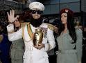 SASHA BARON COHEN spills 'ashes' on Ryan Seacrest at Oscars ...