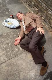 an elderly gentleman who has fallen in the street.