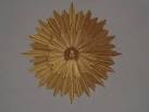 Apollo's head sits in a golden sunburst, high up in the domed ceiling of the - via Daymix
