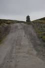 NH5414 : View uphill along footpath towards cairn - via Daymix