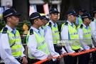 Police officers stand guard during a pro-democracy rally in Hong.