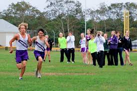 Senior Cooper Chapman and junior Mikey Schroeder rally to the finish line. Ivy Ashe - ia_xcountry_chapman_schroeder