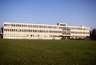 The large grass area in front of the building provided space for relaxation - via Daymix