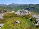 Smooth granite tors surround a small bog with cairn on this wonderful top. - via Daymix
