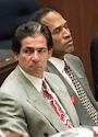 Robert Kardashian sits with