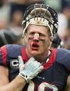 J.J. Watt (99) of the Houston Texans is bloodied as he walks off.