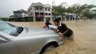 Thousands flee Malaysia floods, dam wall broken