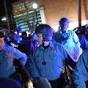 Ferguson protests: Time and rain cool tempers; hunt on for.
