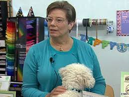 After an experimental cancer treatment, Linda Campbell has returned to work, with her dog Peanut. \u0026quot;It was pretty devastating,\u0026quot; she said. - art.linda.campbell2.cnn