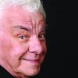 writer Barry Cryer sits