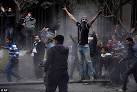 Hundreds clash with police in Cairo as groups gather to mark.