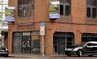 A former stockbroker's office, at the corner of High Street (foreground) and - via Daymix