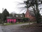 Pretty in Pink. Garage doors next to an infill house on the site of one of - via Daymix