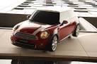 A seemingly suspended MINI Cooper on the side of a building at the Westfield - via Daymix