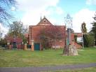 The end view of Lord Pirbright's Hall showing the village sign and the - via Daymix