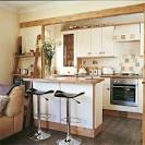 Open-plan country style kitchen-living room with breakfast bar ...