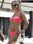 CAROL MCGIFFIN shows off her impressive bikini body as she.