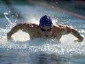 Young Man Swimming the Butterfly Stroke Photographic Print at Art.