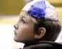 Jacob Humes, 9, wears a yarmulke as he listens to Rabbi Leonard Lifshen
