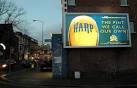 Advertising hoarding, Belfast. Illuminated advertising hoarding on the - via Daymix