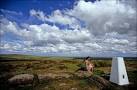 Big skies above the summit Trig Point on White Edge in the Peak District. - via Daymix