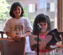 Maria LoCicero and Leandra Blander, students at Summers-Knoll School, read from the book \u0026quot;Moon Wolf,\u0026quot; which they helped illustrate. - maria-and-leandra