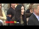 Rosario Dawson monkeys around at Zookeeper premiere... but it's ...