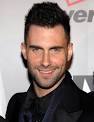 Adam Levine smiles