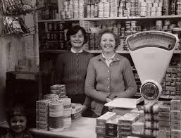 Nellie Jones with an assistant at the dairy counter, with young Henry sneaking into the photo ... - scan0001-1_2