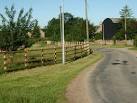 A 4 rail and post wooden fence brings a bit of character to Mill Farm - via Daymix