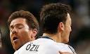 Mesut Ozil, right, is congratulated by Xabi Alonso after scoring a late ... - Mesut-Ozil-Real-Madrid-001