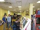 One of the rows of coin operated video game machines at the conference - via Daymix