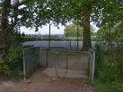 Tennis courts and further back, the children's playground and football - via Daymix