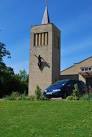 "Jesus in Jeans". Controversial new sculpture on tower of Uckfield Catholic - via Daymix
