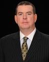 as men's basketball coach