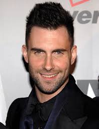 Adam Levine smiles