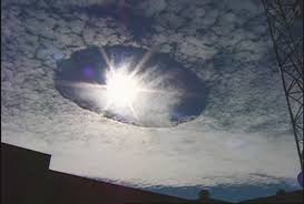 Hole Punch Clouds Over