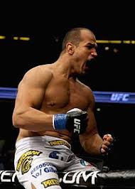 Junior dos Santos (top) celebrates after knocking out Cain Velasquez for the