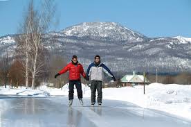 Skaters enjoying the groomed municipal path in Magog (Stephane Lemire photo) - Skaters_ice_path_in_Magog_Stephane_Lemire