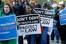Justices hear arguments in health care law case